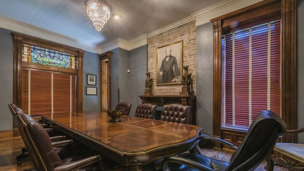 The first floor of the home was flooded, so the Van Trumps took it down to the studs. But they preserved as much as they could, including the fireplace mantel and trim in this parlor to the left of the foyer. The three-story home was built in 1887 by David Slater, a tailor from Ireland and a prominent early citizen of Kansas City.