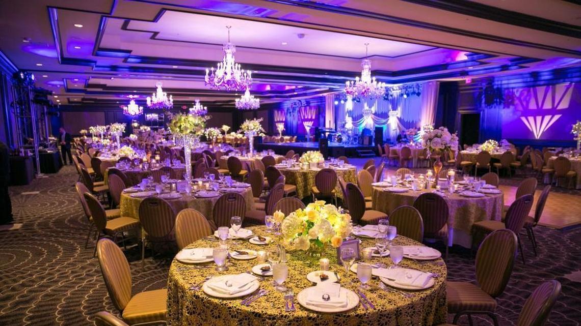 The tables at the Diamond Ball were covered with gold lace overlays and black linen. Special light effects projected “diamonds” onto the walls.