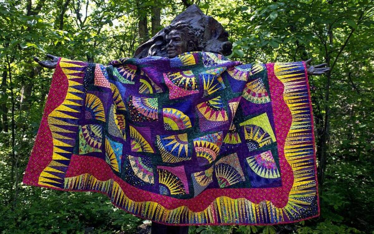 
Janette Sheldon’s colorful quilt, covering Lu Zengkang’s Michael Jackson sculpture at the Overland Park Arboretum, is a paper-pieced quilt created from a New York Beauty pattern. Sheldon will display work at the Kansas City Regional Quilt Festival in Overland Park June 19-21.

