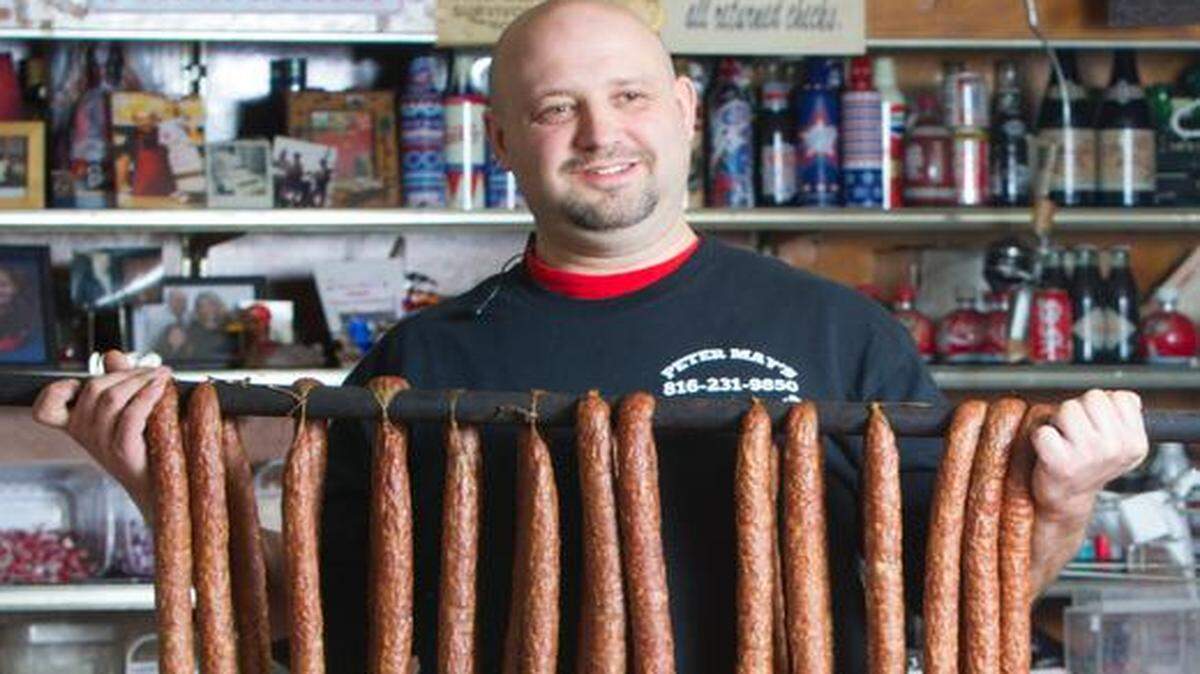 
Mike Loges displays a rack of handmade Polish sausage, or kielbasa, at Peter May’s House of Kielbasa.
