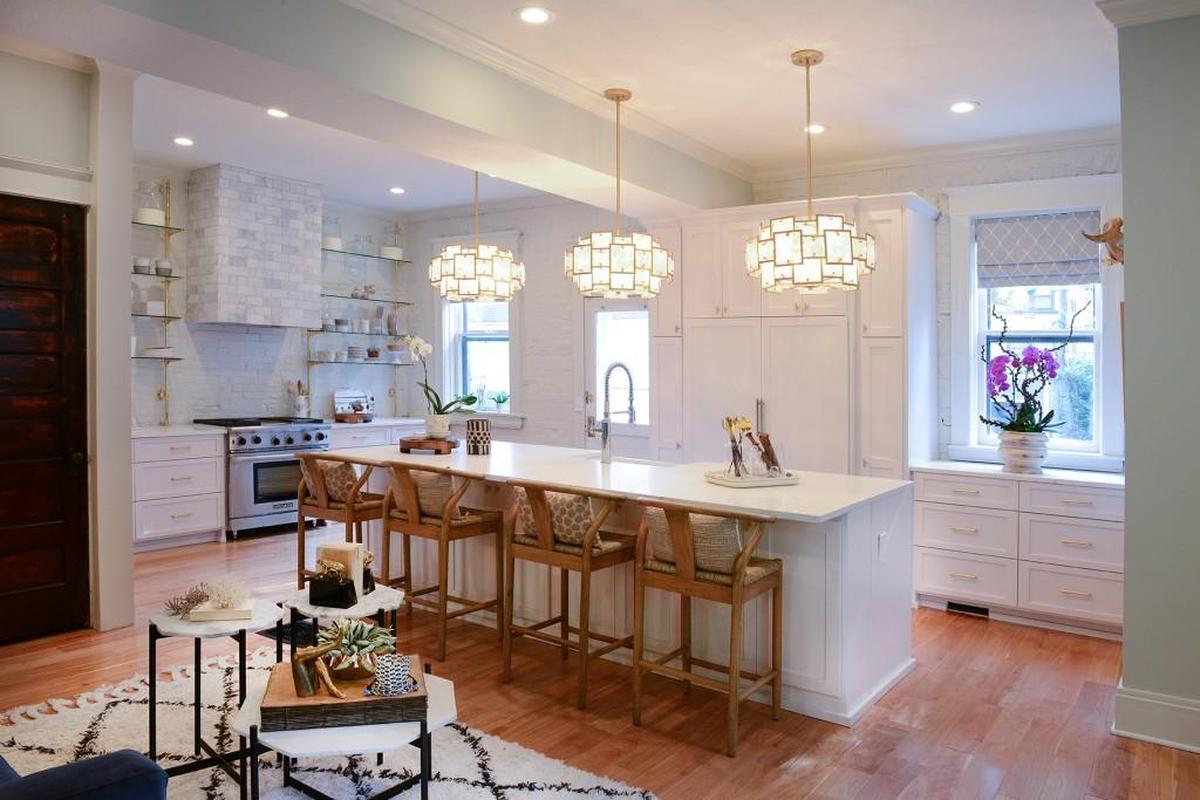 A recent renovation left the kitchen outdated and tacky. Tamara Day gave it a fresh new look that references the old French architectural details of the rest of the home.