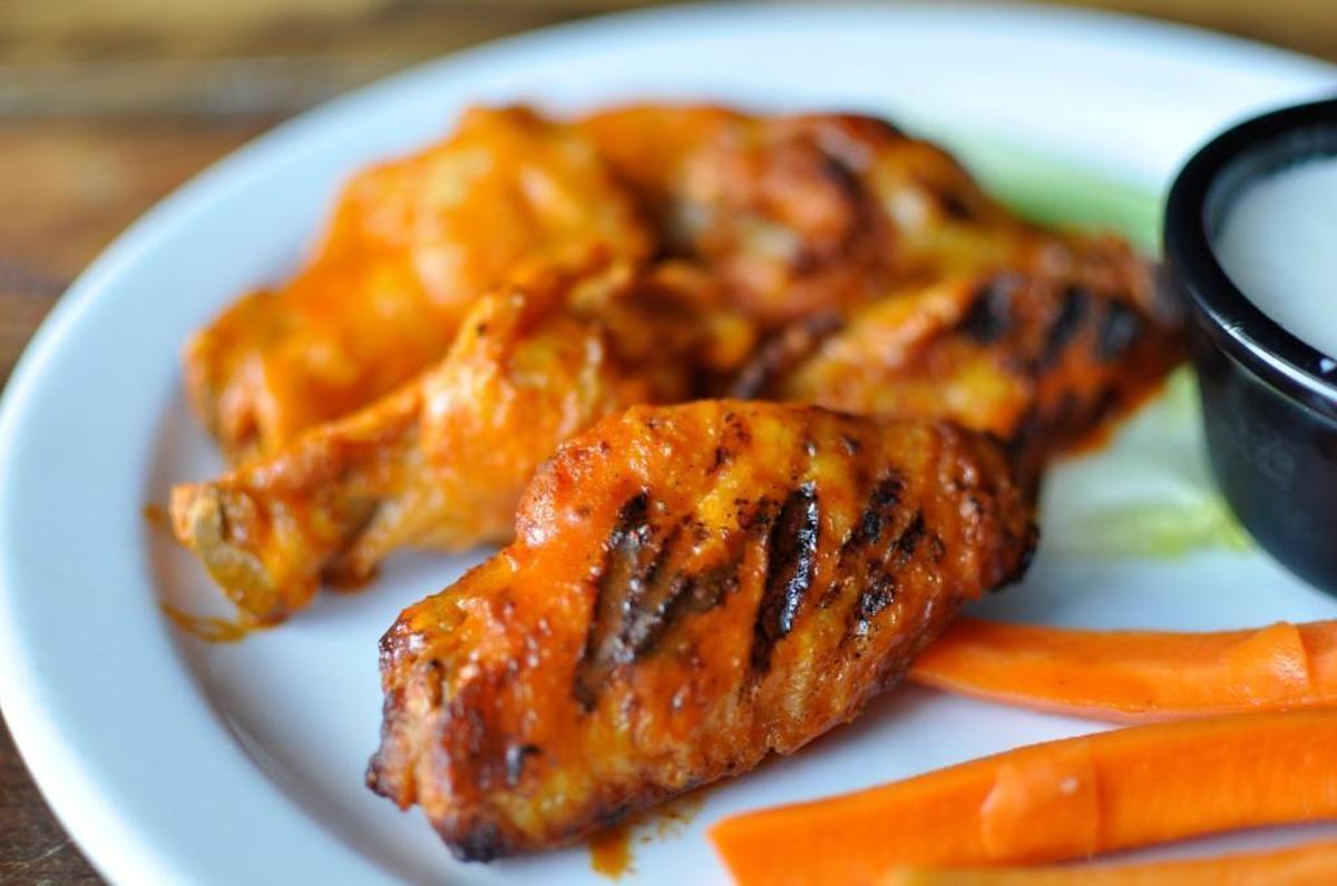 Tower Tavern regulars ask for the Buffalo wings charred, or finished on the grill.