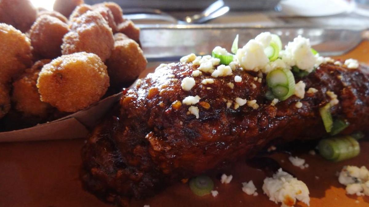 Fried okra and a Pecan Lodge fried rib: spicy and crunchy layers of Cajun flavors.