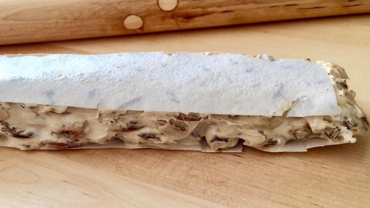 Torrone is shaped into a log and wrapped in wafer paper.