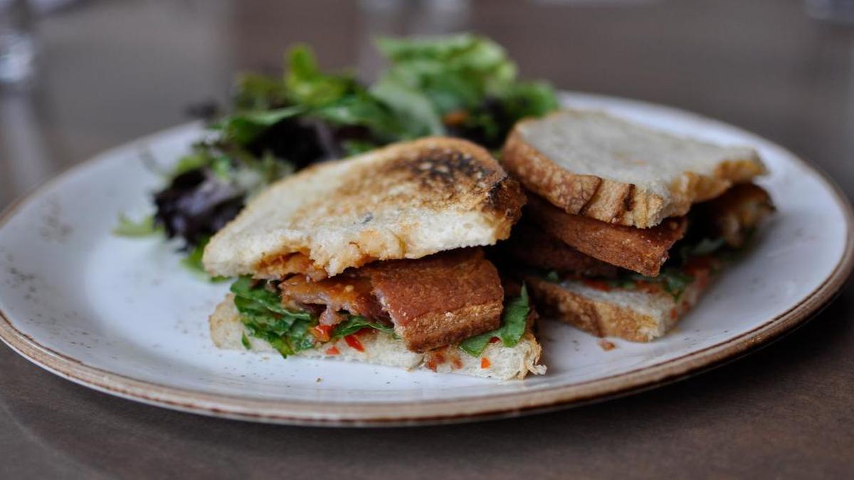 
Cleaver & Cork’s Green Tomato BLT comes with thick slices of braised bacon from the Local Pig, fried green tomatoes, arugula and spicy red pepper jelly.
