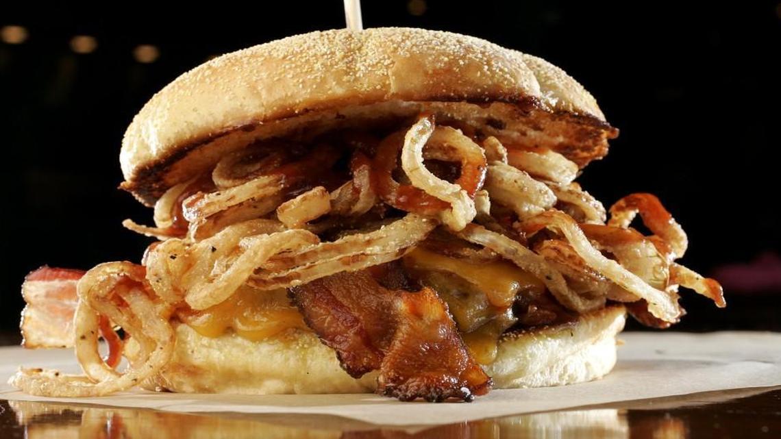 BRGR’s Roadhouse burger is loaded with bacon, onion straws, Wisconsin cheddar cheese and barbecue sauce.