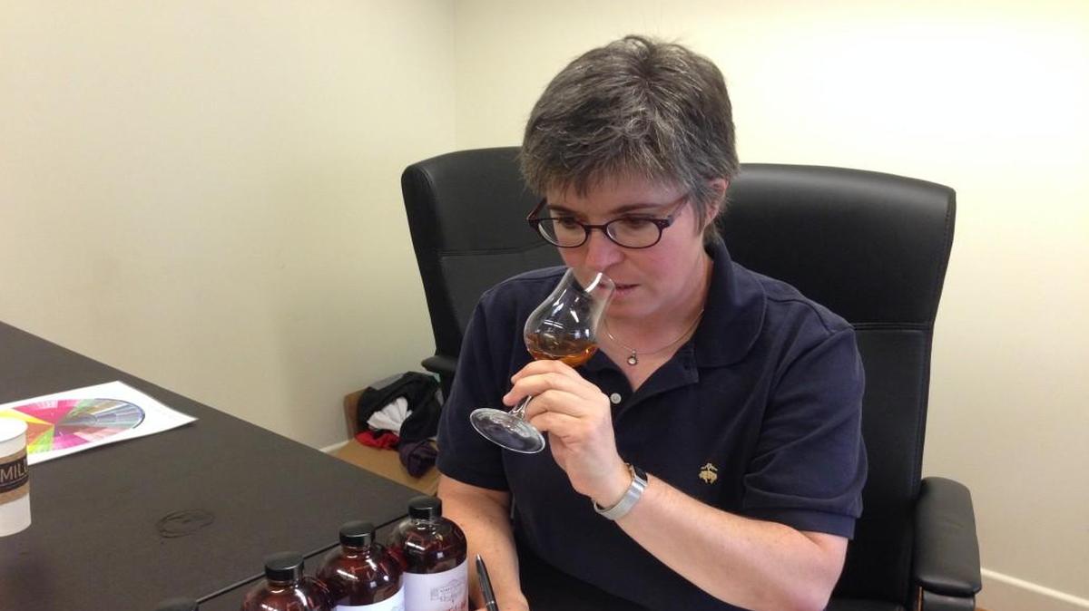
Nancy Fraley of Berkeley-based Nosing Services evaluates a bourbon sample at Tom’s Town Distilling Co.
