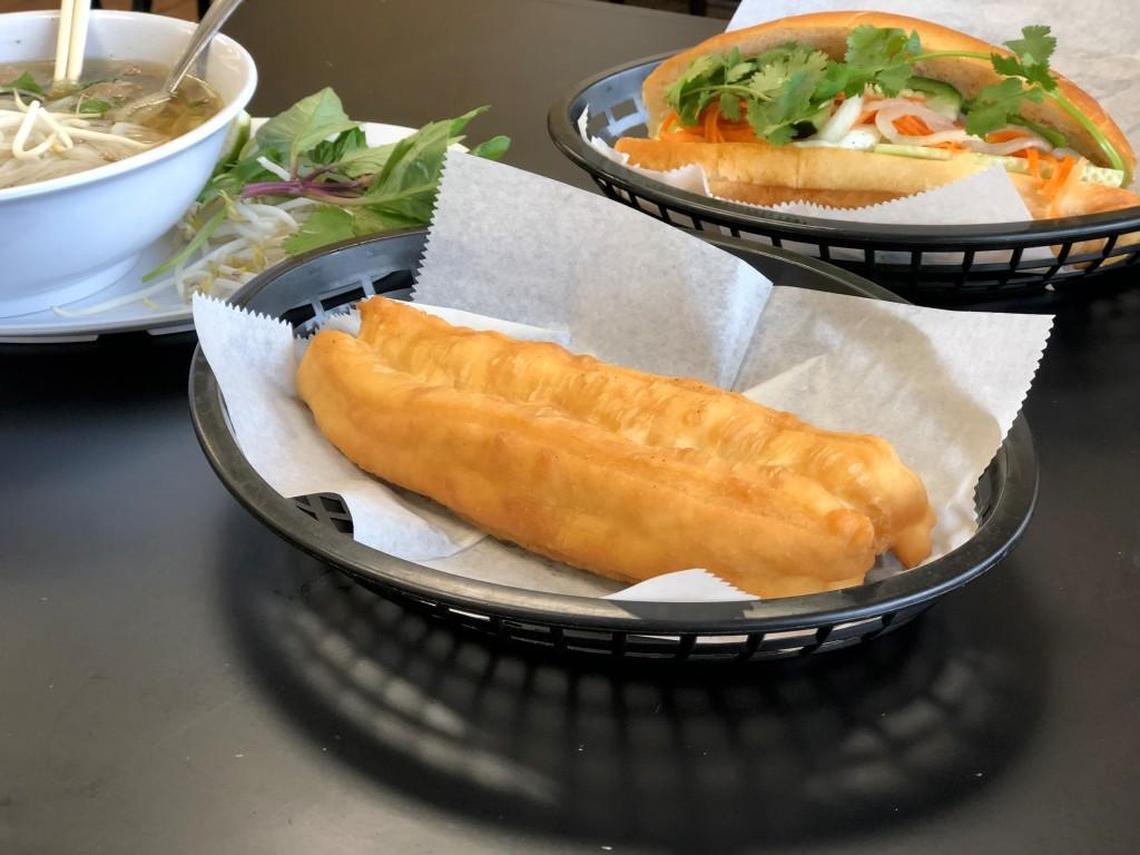 Bun Mee Phan serves doughnuts with pho. Customers dip the lightly sweet, funnel cake-like doughnuts in the savory broth.