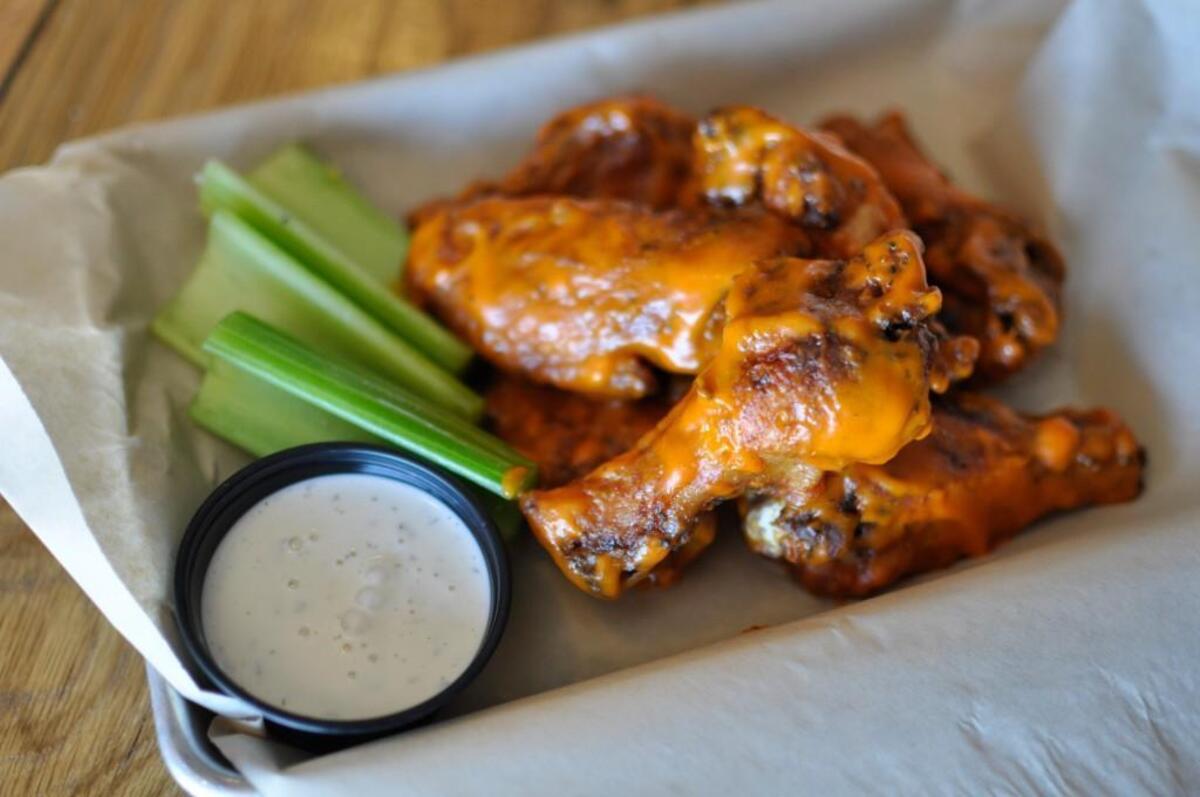 Martin City Brewing Co.’s appetizers include MCBC wings ($9), which come in four flavors: Buffalo (shown here), Railroad, BBQ and Dry. The wings come with blue cheese or America sauce — aka ranch.