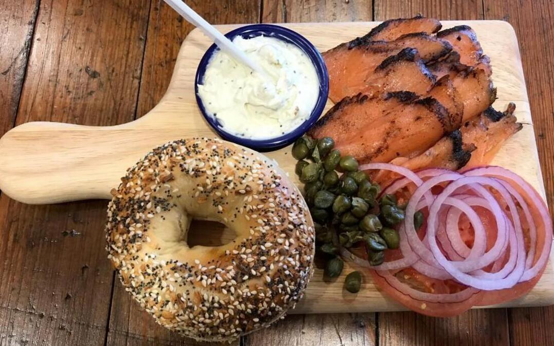 Meshuggah bagel board: Everything bagel with pastrami-encrusted salmon, “toasted everything” schmear, tomato, red onion and capers for $12.95. Available at Overland Park location.