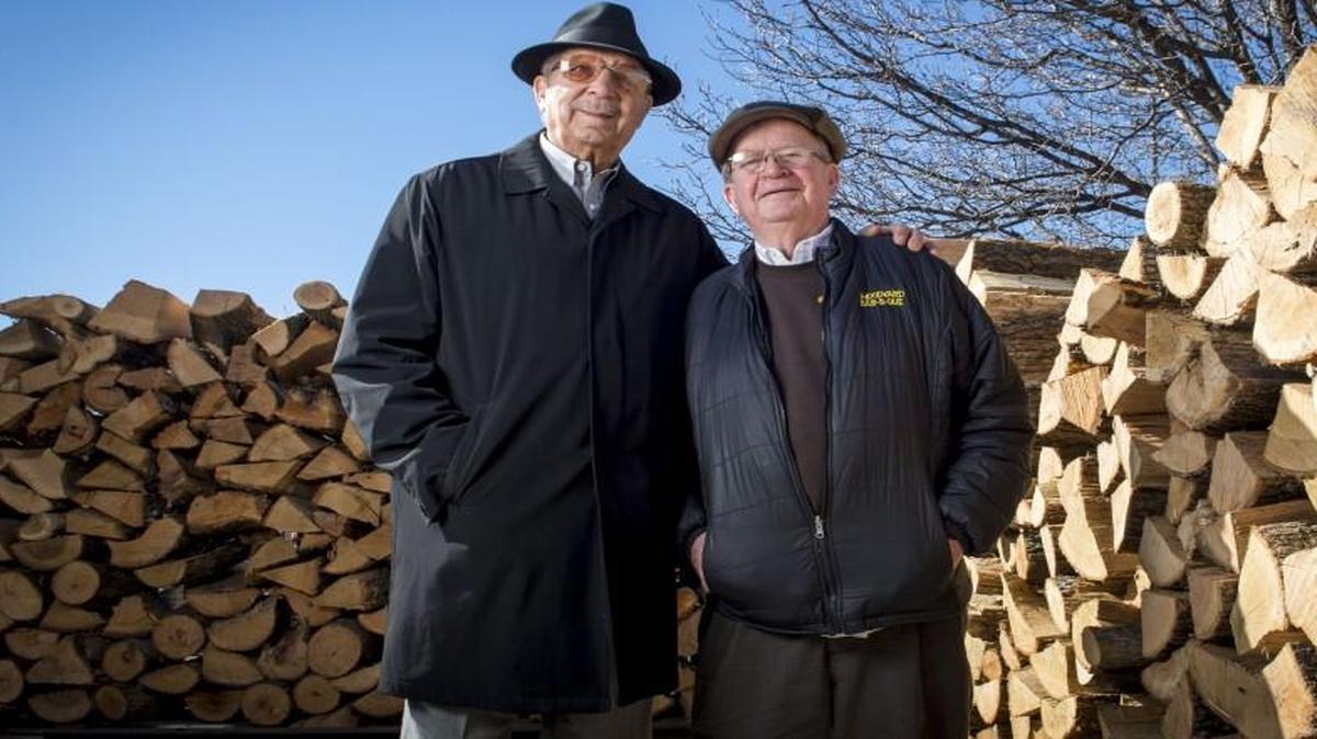 Barbecue baron Ollie Gates of Gates & Sons Bar-B-Q (left) and Frank Schloegel, owner of Southside Wood Co. and co-owner of Woodyard Bar-B-Que, have forged a decades-long friendship and business relationship. Schloegel has been the main provider of wood for Gates and his restaurants for over 50 years.