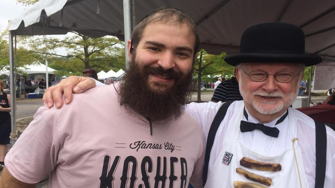 
Rabbi Mendel Segal (left) and Ardie Davis in his Remus Powers PhB apron and bowler hat at the Kosher BBQ Festival
