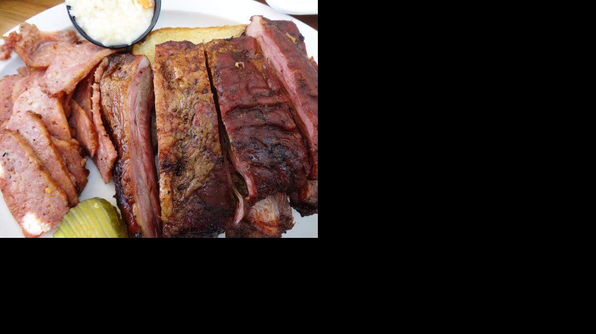 
Hickory smoked house-made sausage and spareribs from Snead’s original barbecue pit. 

