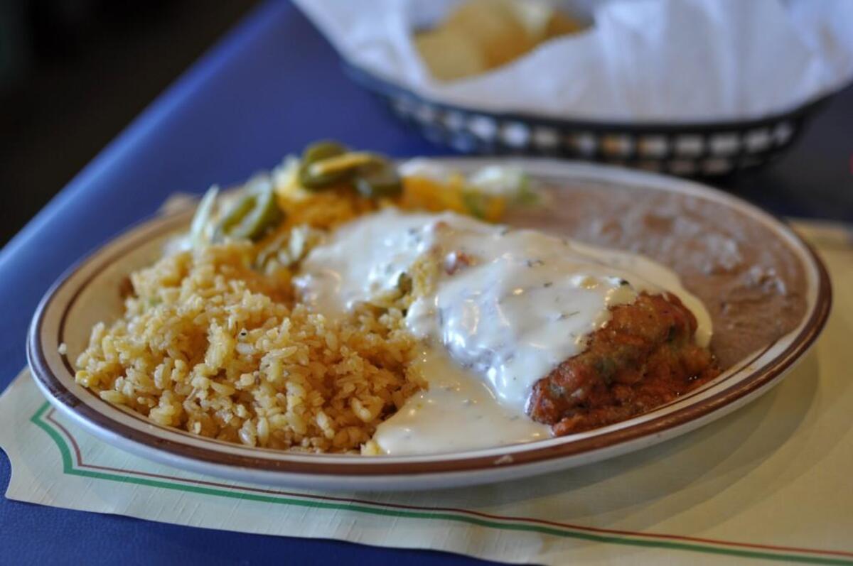 Manny’s chile relleno — with choice of ground beef or Monterey Jack cheese or both — comes with rice and beans.
