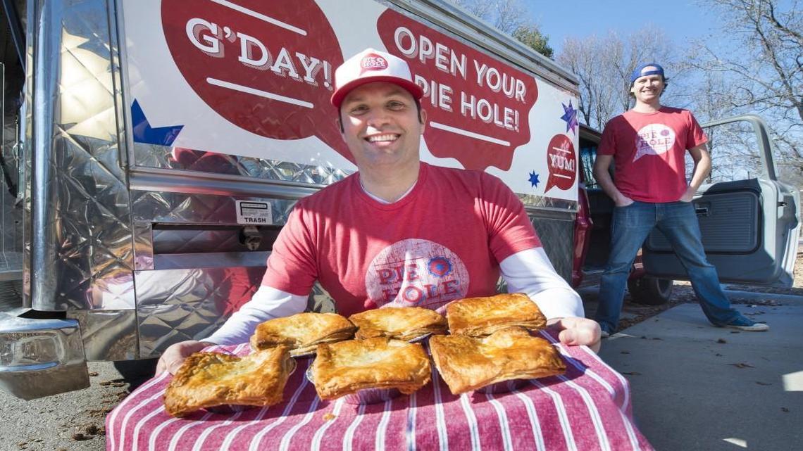 
Tim Moore (left) known as the "Pie Slinger" and "Pie Bringer," and Chris Knowles, are owners and operators of The Pie Hole food truck, which features Australian meat pies.
