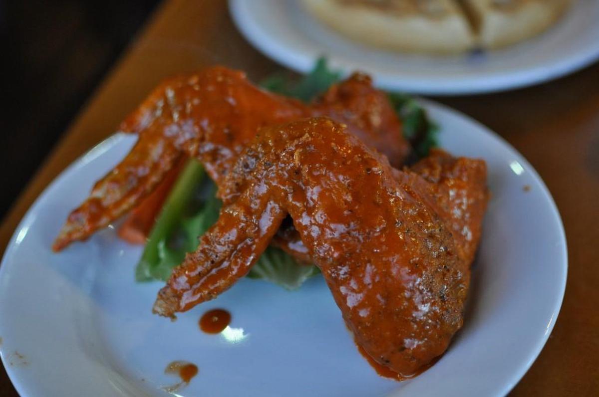 Game Day Chicken Wings and Fish serves hot wings in the morning alongside hot waffles and syrup.
