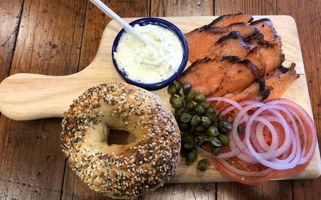 Meshuggah bagel board: Everything bagel with pastrami-encrusted salmon, “toasted everything” schmear, tomato, red onion and capers for $12.95. Available at Overland Park location.