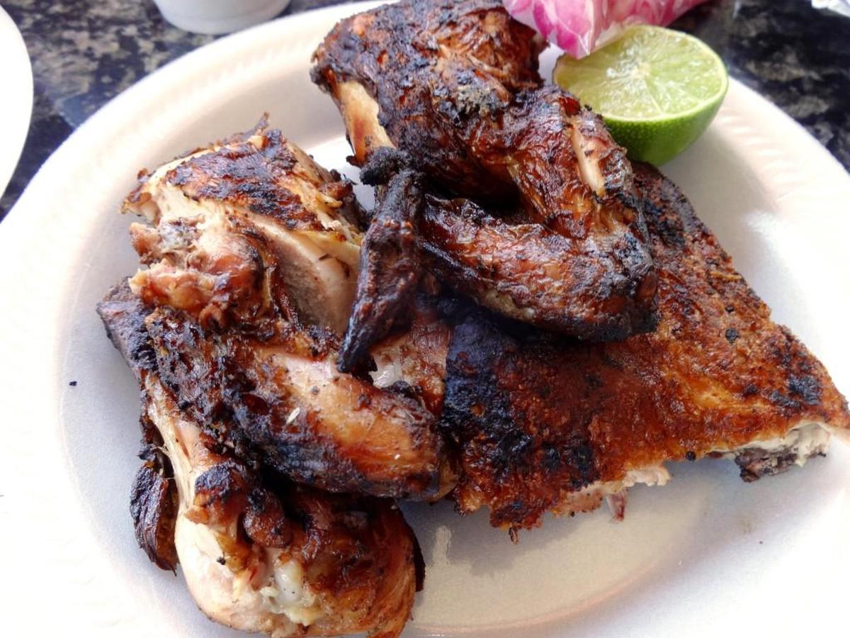 El Pollo Rey’s wood-fired half chicken is served with soft tortillas and optional sides and condiments.