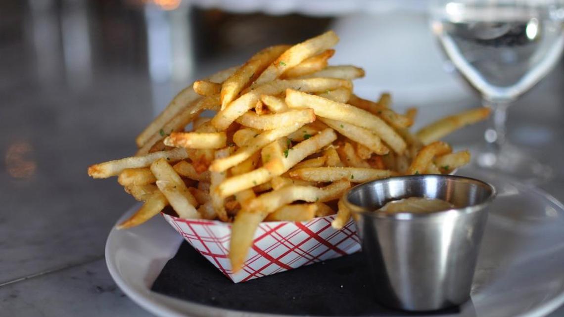 Ça Va specialized in boutique wines and had a small menu of French-inspired food, like these pommes frites. The Westport champagne bar has permanently closed.