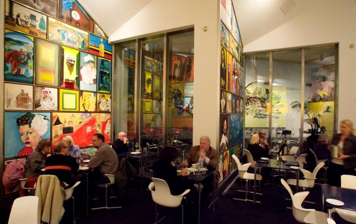 The walls of Cafe Sebastienne in the Kemper Museum are covered in art.