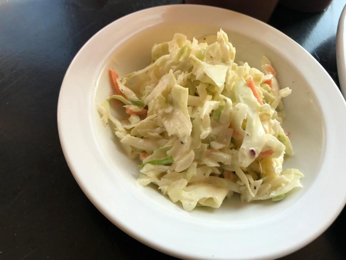 Crisp coleslaw is a hybrid: slighty creamy and slightly vinegary.