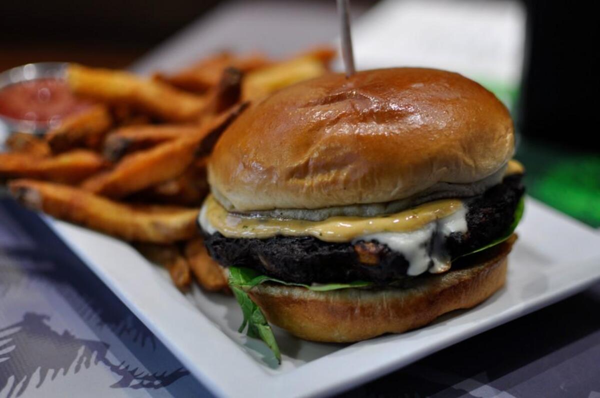 Burg & Barrel’s veggie burger starts with a spicy black bean patty. It’s topped with pepper jack cheese, bibb lettuce, tomato and cilantro-chipotle mayo.