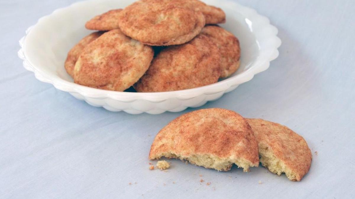 The captivating aroma of cinnamon wafts through the kitchen when baking delicious snickerdoodle cookies.
