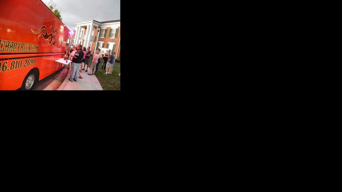 
People line up for food at the Woodneath Library Center’s monthly food truck roundup every third Thursday through October. 
