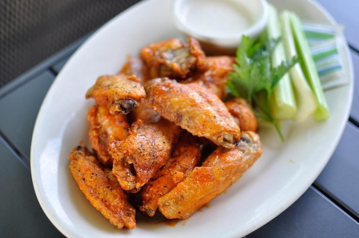 Nick and Jake’s, a restaurant and bar with locations in Parkville, Overland Park and the south Plaza, serves its pepper-flecked Buffalo wings with blue cheese and celery.