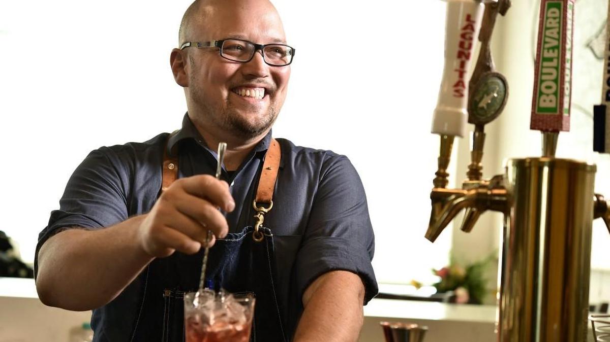 Jonathon Bush, bar manager at Novel, makes cocktails with fresh summer ingredients, easily available now from farmers markets. Bush mixes a Roots to Branches.