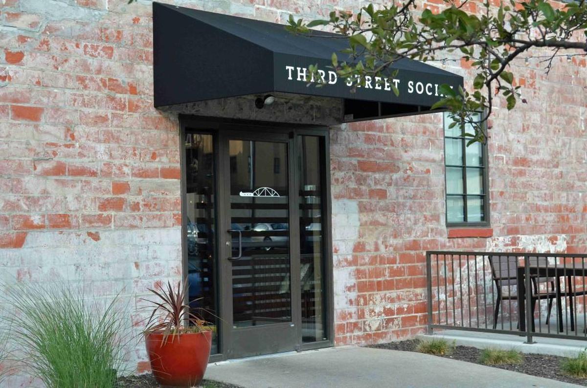 One of the entrances to Third Street Social, a chef-driven American restaurant at 123 S.E. Third St. that features an extensive menu with generous portions.