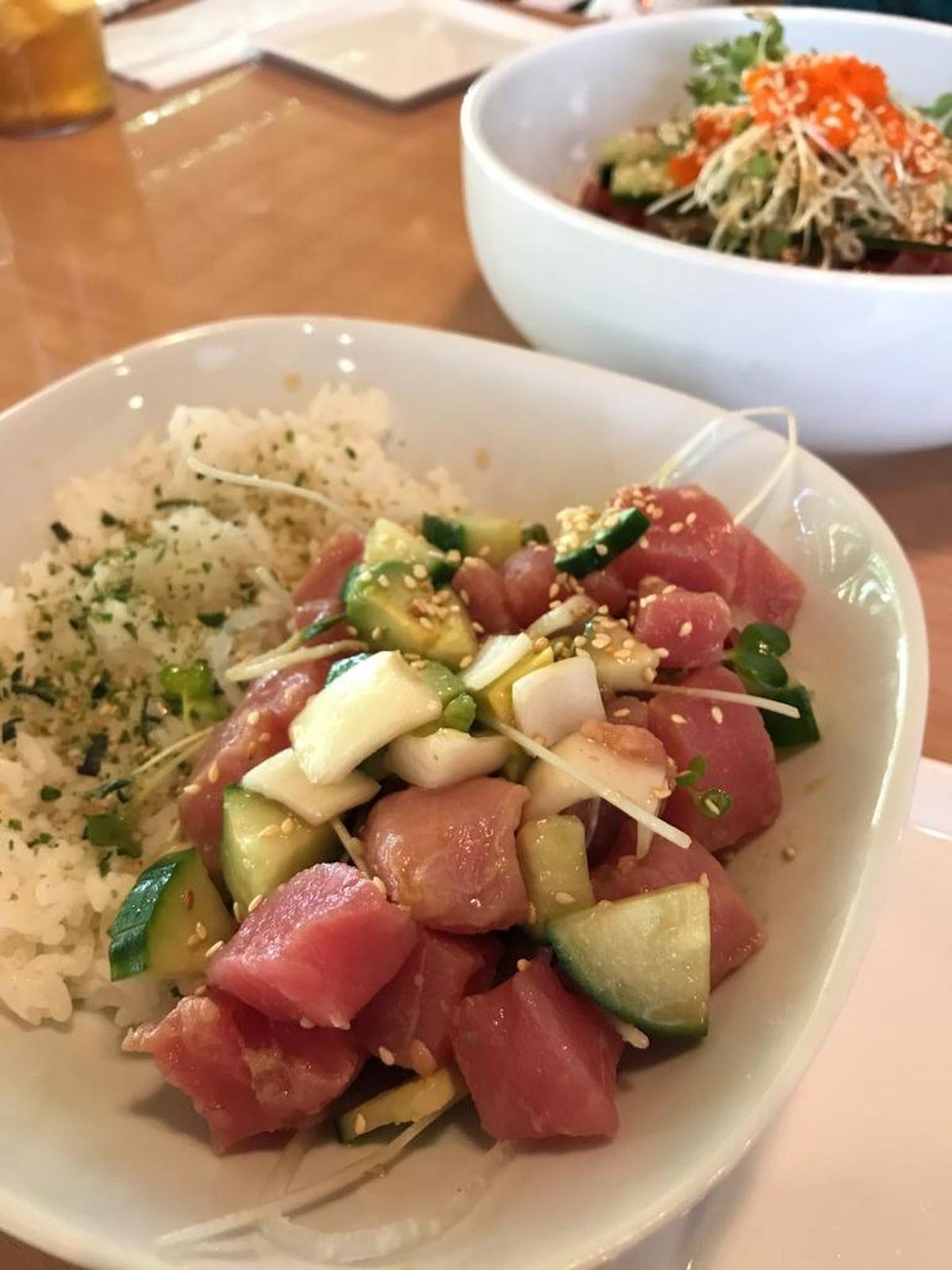 Bob Wasabi Kitchen offers a poke bowl with ahi tuna sashimi, as well as a spicy fish bowl (background).