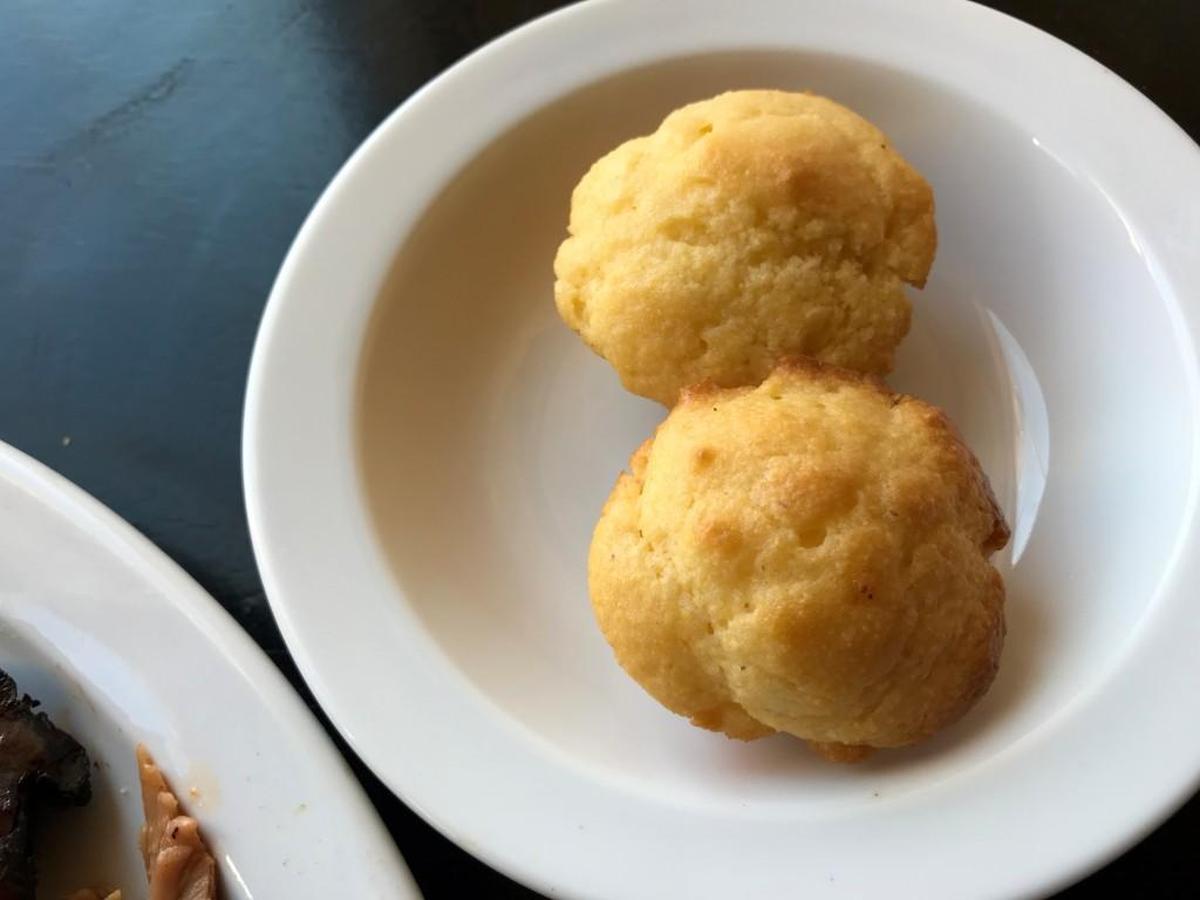 Mini cornbread muffins soaked in butter is a side option.