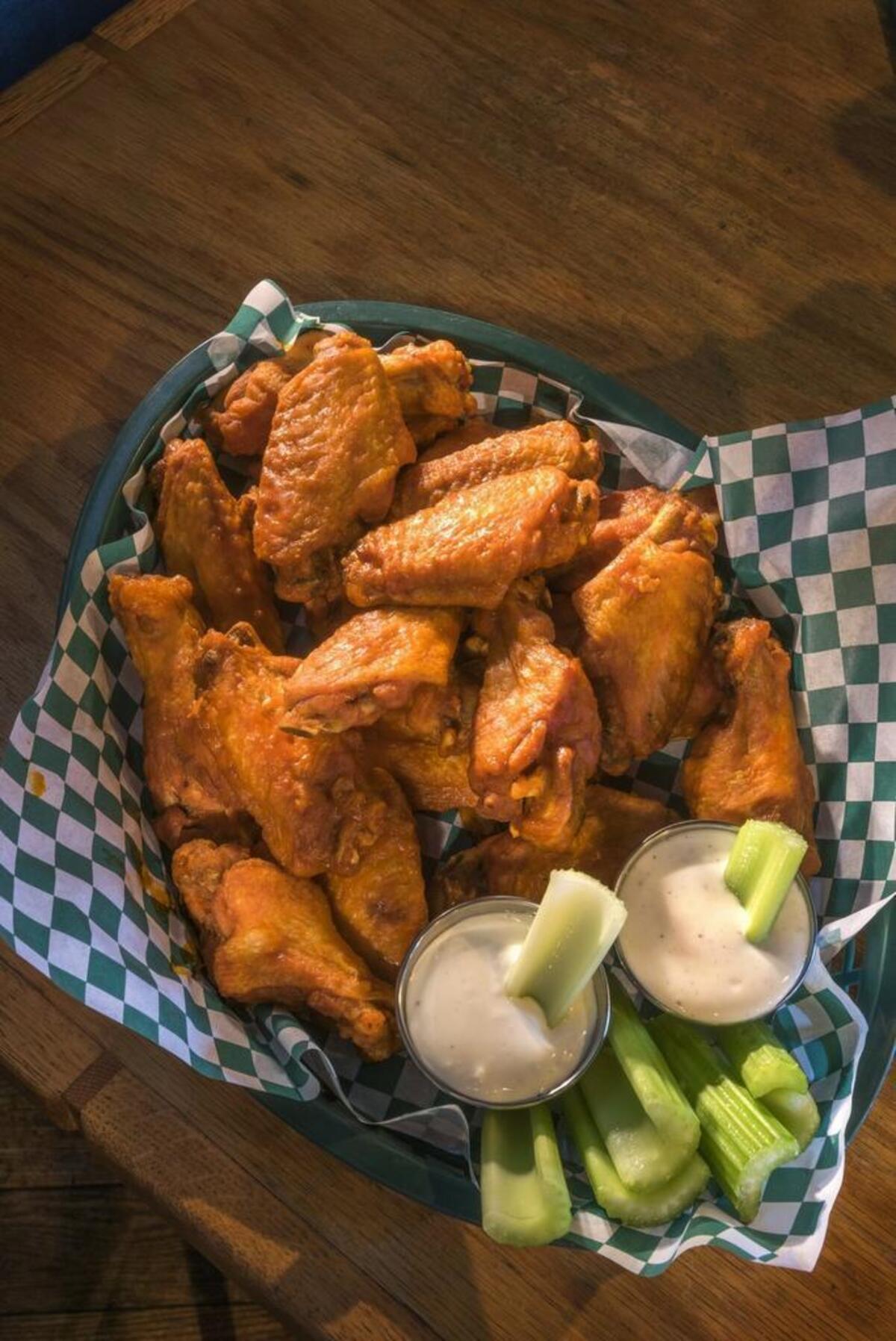 Regulars at Al’s Bar & Grill in Parkville know to order the authentic Buffalo-style hot wings perfected by owner Al Burns.