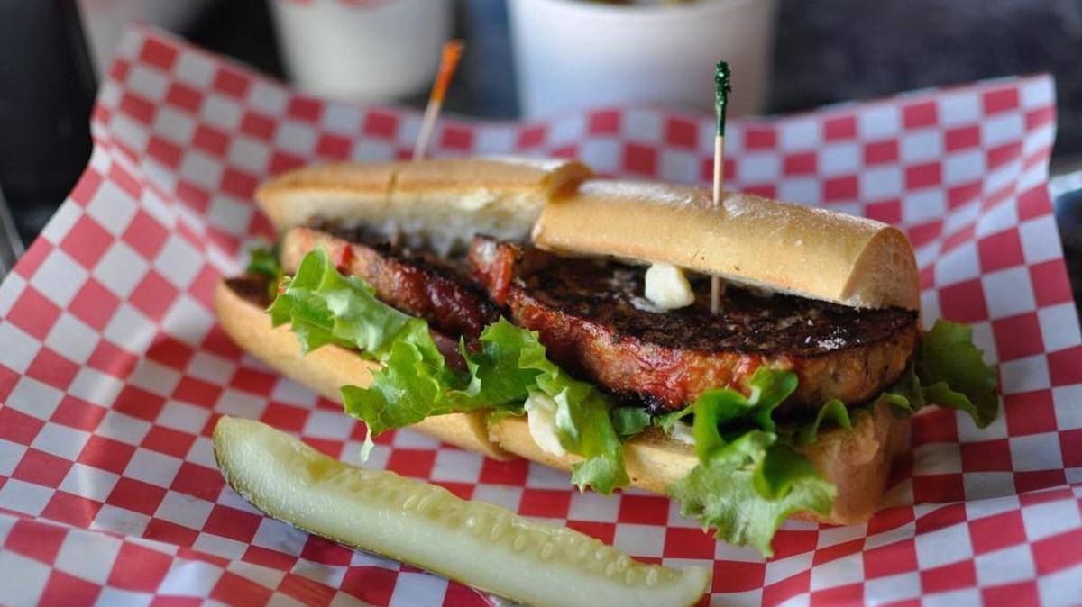 D’Bronx tops its hot meatloaf sub sandwiches with lettuce, tomato and mayo.