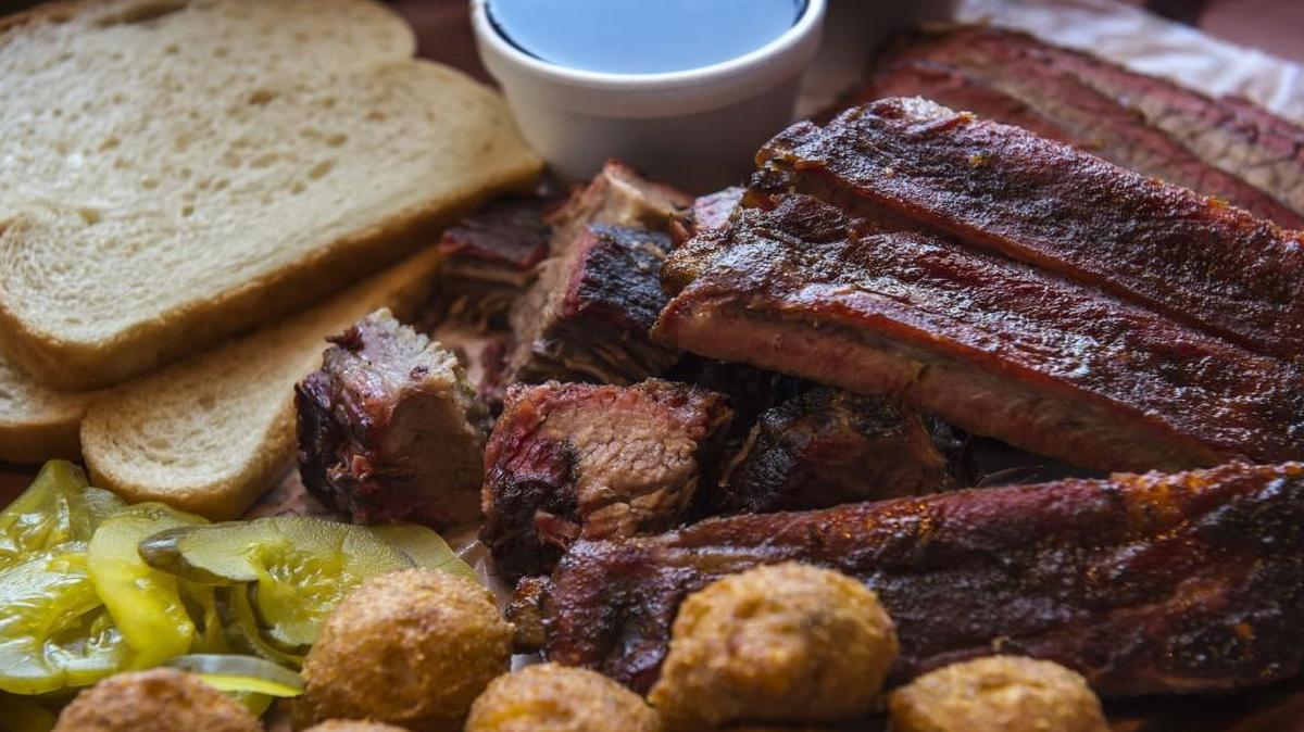 A combination plate of burnt ends, ribs and brisket, with a side of hushpuppies at Slap’s BBQ at 553 Central Ave., Kansas City, Kan.