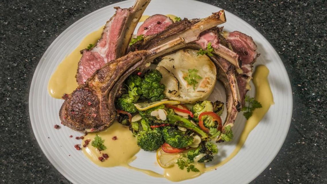 Chaz’s Colorado lamb chops are served with grilled chili garlic broccoli, toasted almonds, boulangerie potatoes, lemon verbena and hollandaise sauce.
