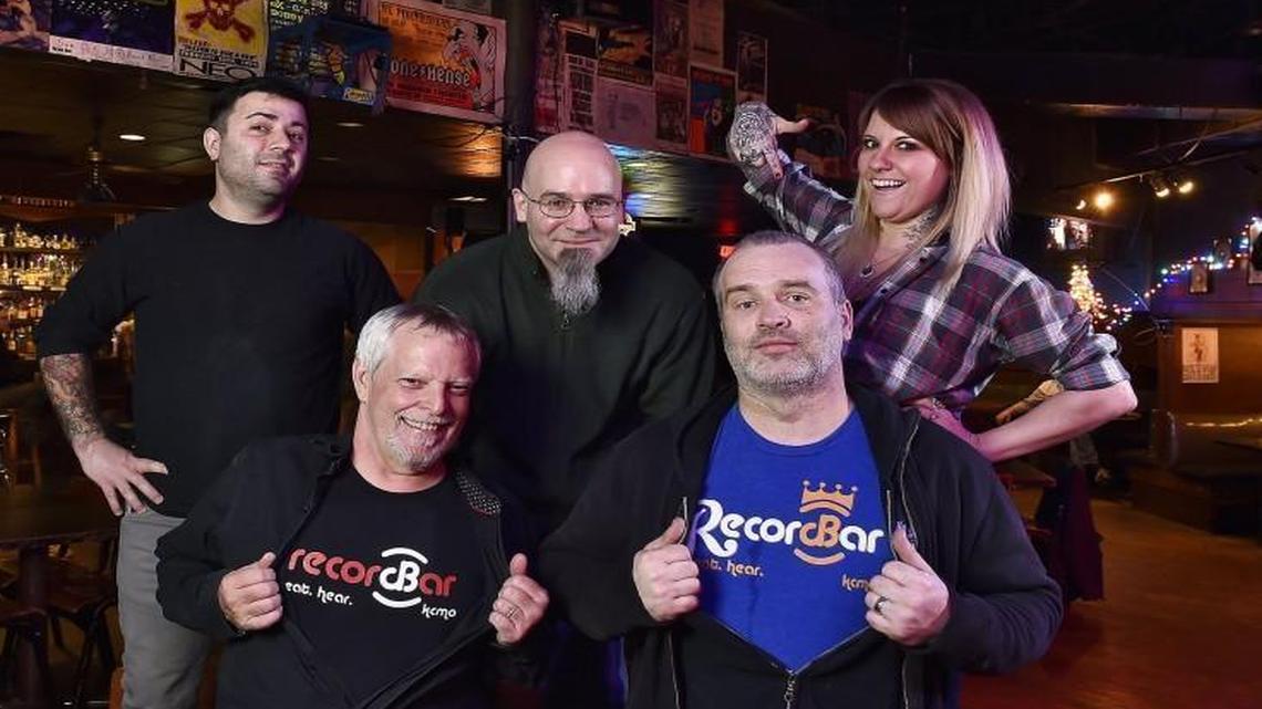 The Record Bar will close Jan. 2, 2016. Longtime employees, including sound engineers Mark “Buzz” Collins (counterclockwise from bottom left), Paul Malinowski and bartenders Kitty Mitchell, Tim Whipple and Adam Phillips in the bar.