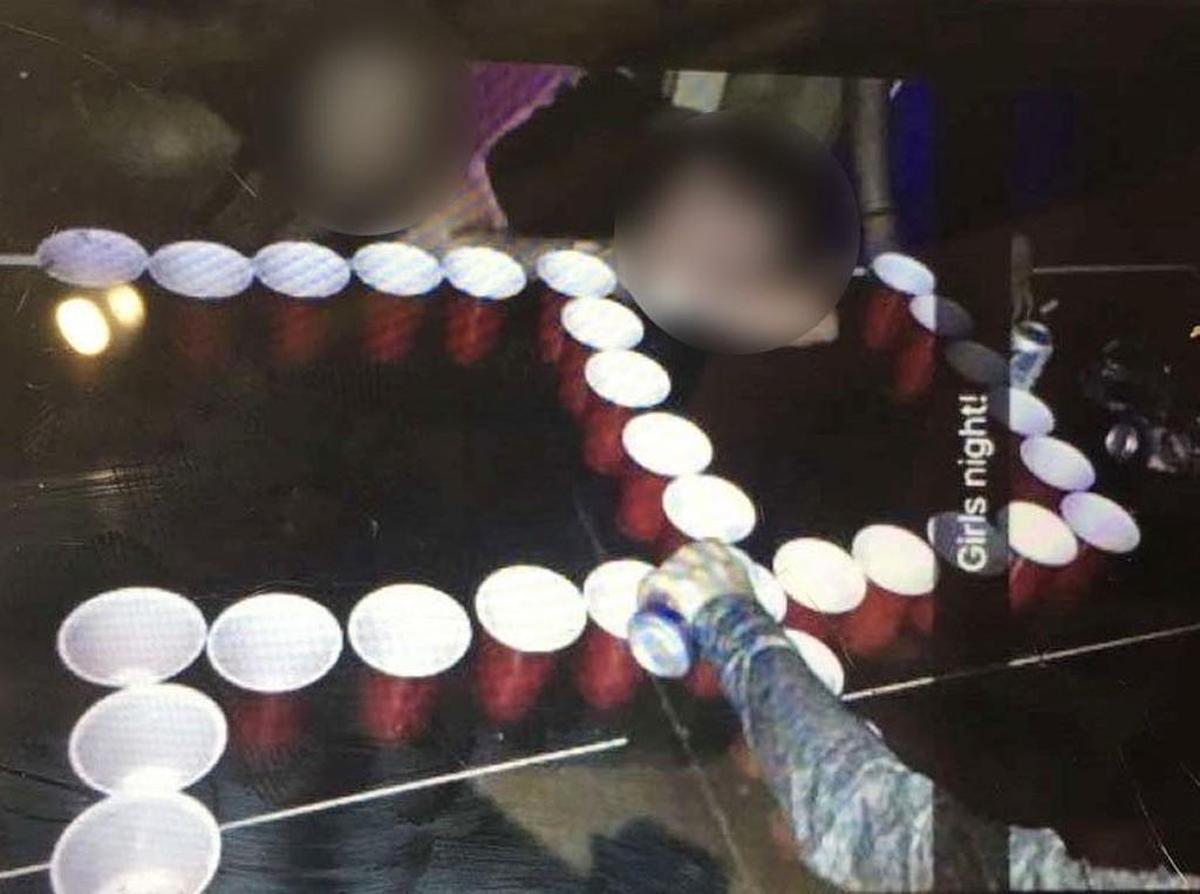 This photo of a swastika made up of beer pong cups has been altered to not reveal the St. Teresa’s Academy girls involved.