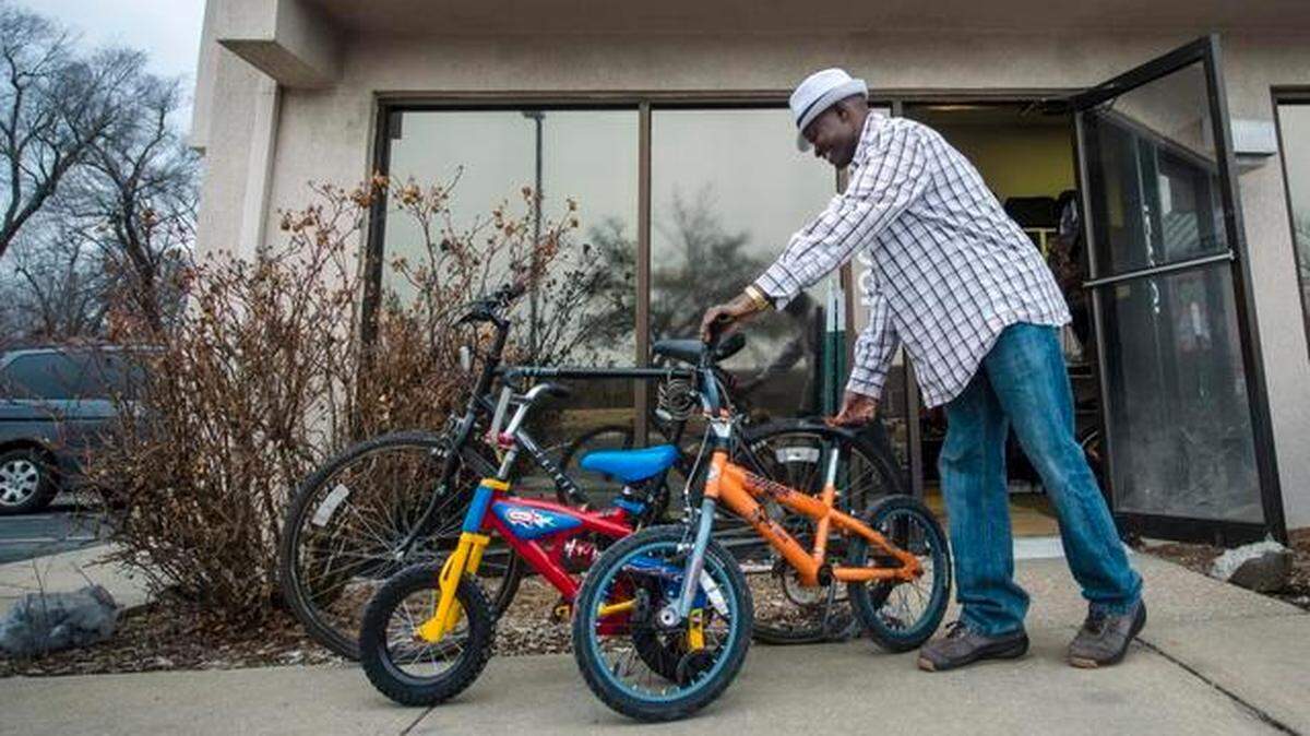 Abdoulie Fatajo puts bicycles outside his Hy5 Traders. Fatajo, originally from Gambia, fixes bicycles, and whatever he doesn’t sell he sends to his sister’s store in Banjul, Gambia.