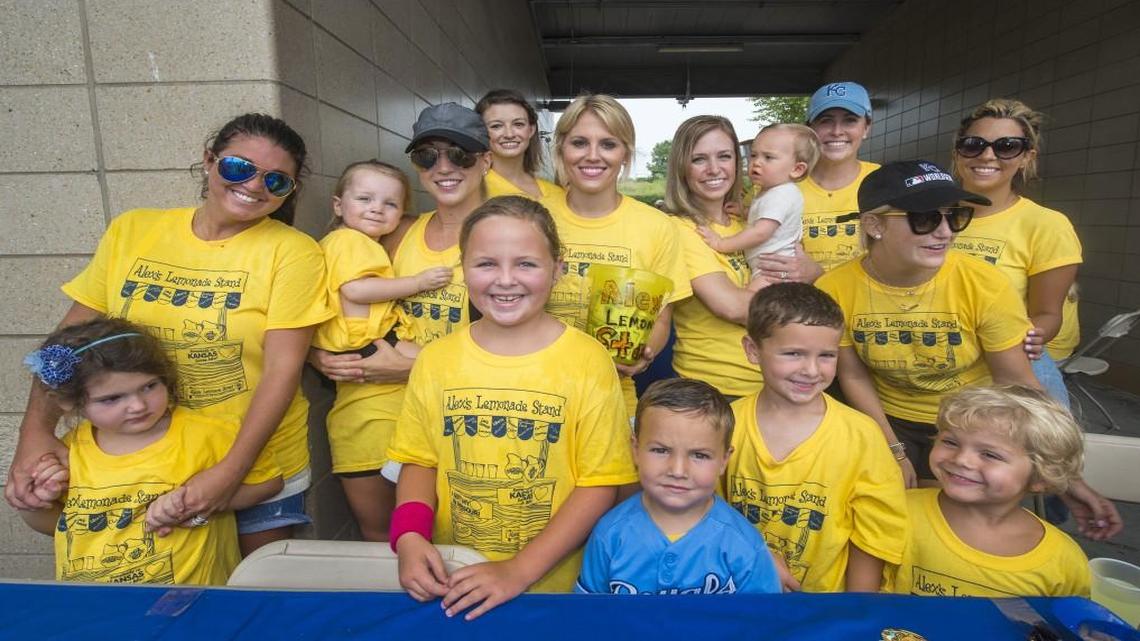 
Royals wives and children were on hand to help with the Alex’s Lemonade Stand fundraiser during the Royals-White Sox game on Aug. 9 at Kauffman Stadium. The fundraiser included selling lemonade and Royals-autographed baseballs. The wives and children (from left, front row) include children Lanie Hochevar, 5; Kate Young, 7; Grant Young, 5; Scott Young, 5; Max Gordon, 4. Second row includes Ashley Hochevar, Katelyn Davis with Sully, 2; Jordan Clark ; Jamie Gordon; Tiffany and Ronan Collins, 10 months; Liz Young; Stephanie Moustakas and Sara Duffy.
