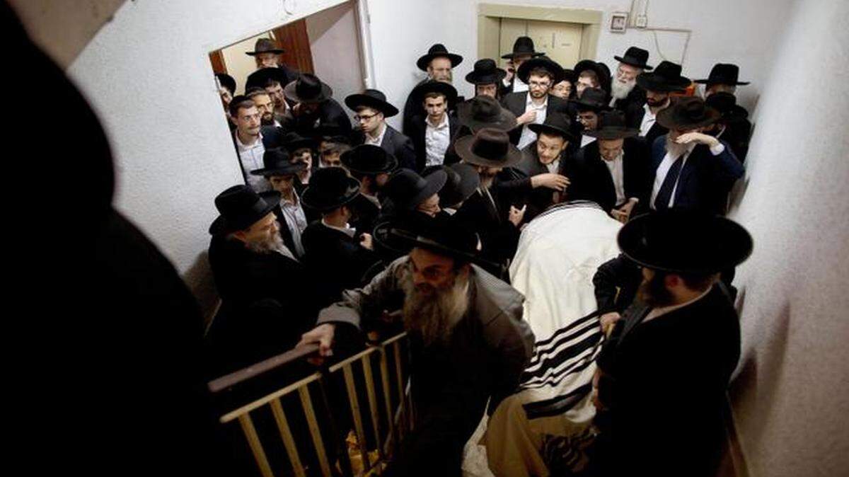 
Orthodox Jews carried the body of Rabbi Mosheh Twersky during his funeral Tuesday in Jerusalem. Twersky was one of five total killed after two Palestinians attacked a synagogue early Tuesday. 
