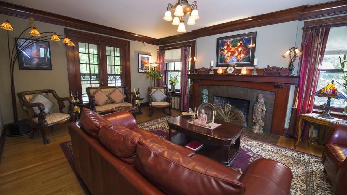 Airbnb guests in the Hyde Park home of Stephen Mulrooney and Jerome Van Wert have the use of the home’s common space. This is their mahogany living room.