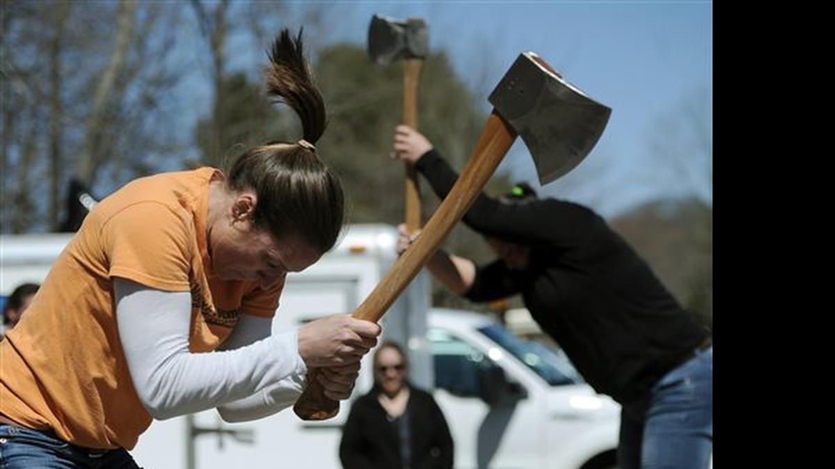 
In this Saturday, April 25, 2015 photo, Alissa Harper, left, and Michele Watkins chop blocks of wood during the Axe Women of Maine's demonstration in Vernon, Conn. Harper, of Bar Harbor, Maine, started Axe Women in 2010. She said its empowering for the women to compete in a male-dominated sport. 
