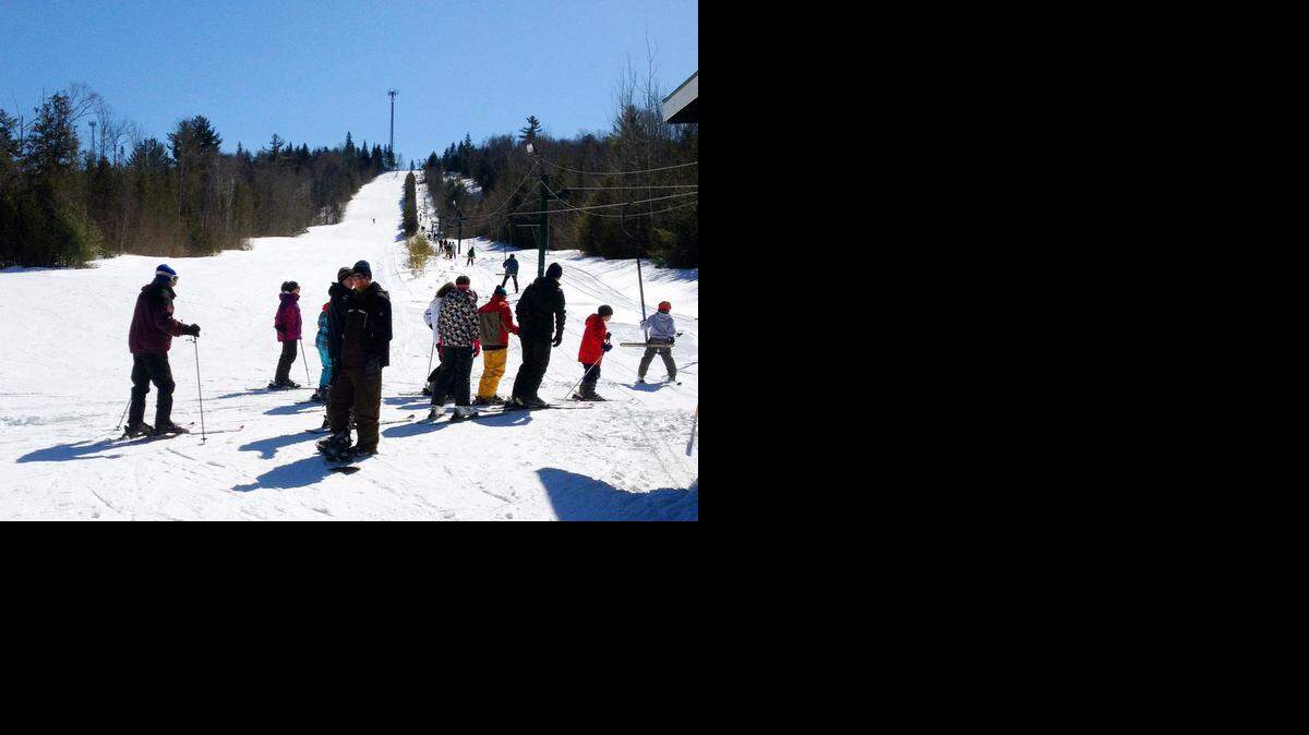 
Maine is home to several small ski areas where lift tickets can be had for $20 or less. On Mount Jefferson in the town of Lee, people waited in a line to buy tickets.
