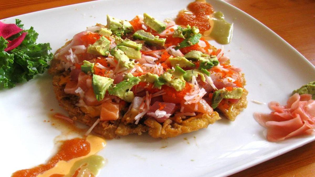 
Wa’s popular sushi pizza is topped with avocado, crab meat, salmon, tuna, red snapper and a drizzle of spicy mayo.
