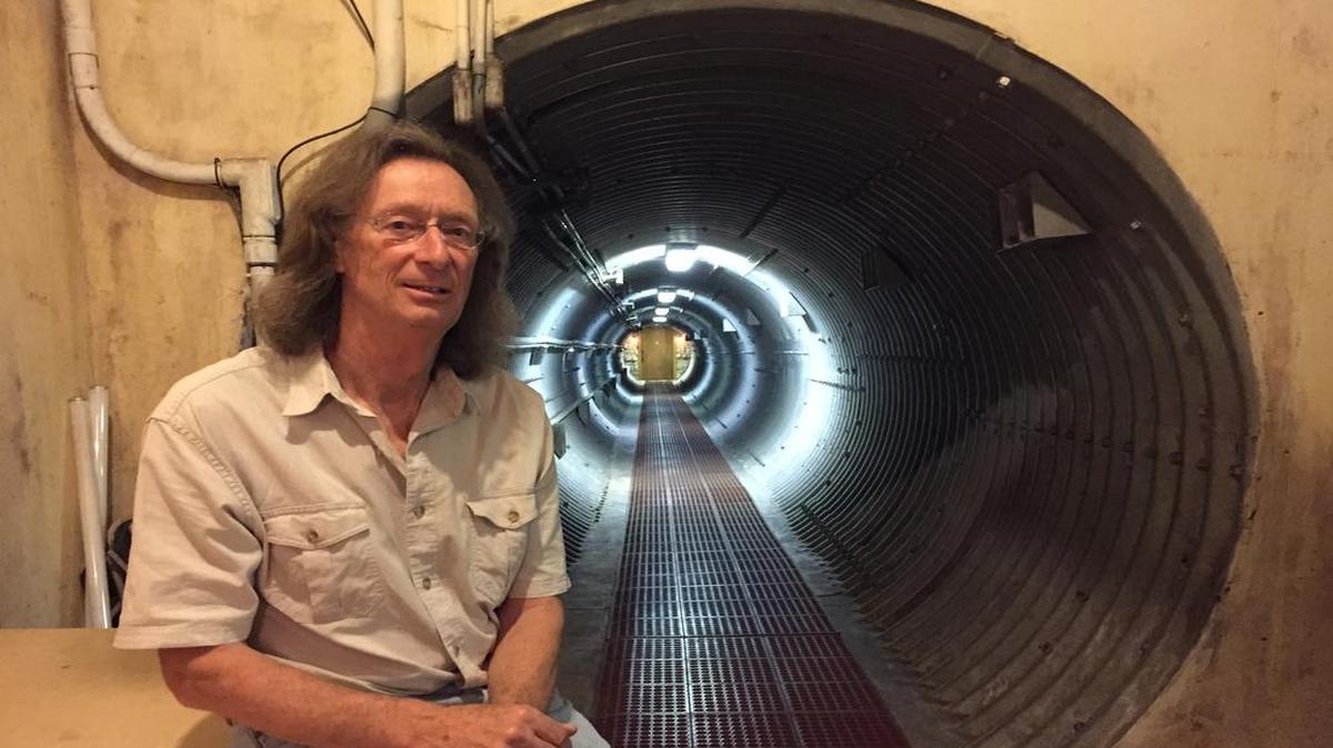 
Ed Peden pauses before walking through a 120-foot lighted concrete-and-steeel tunnel leading to the underground entrance to his home at Subterra Castle, a converted nuclear missile base about 25 miles west of Topeka.
