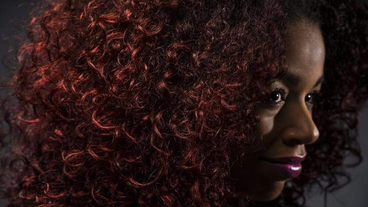 
Monica Stevens, known for her big, beautiful red hair, makes videos of natural hair care advice on YouTube.
