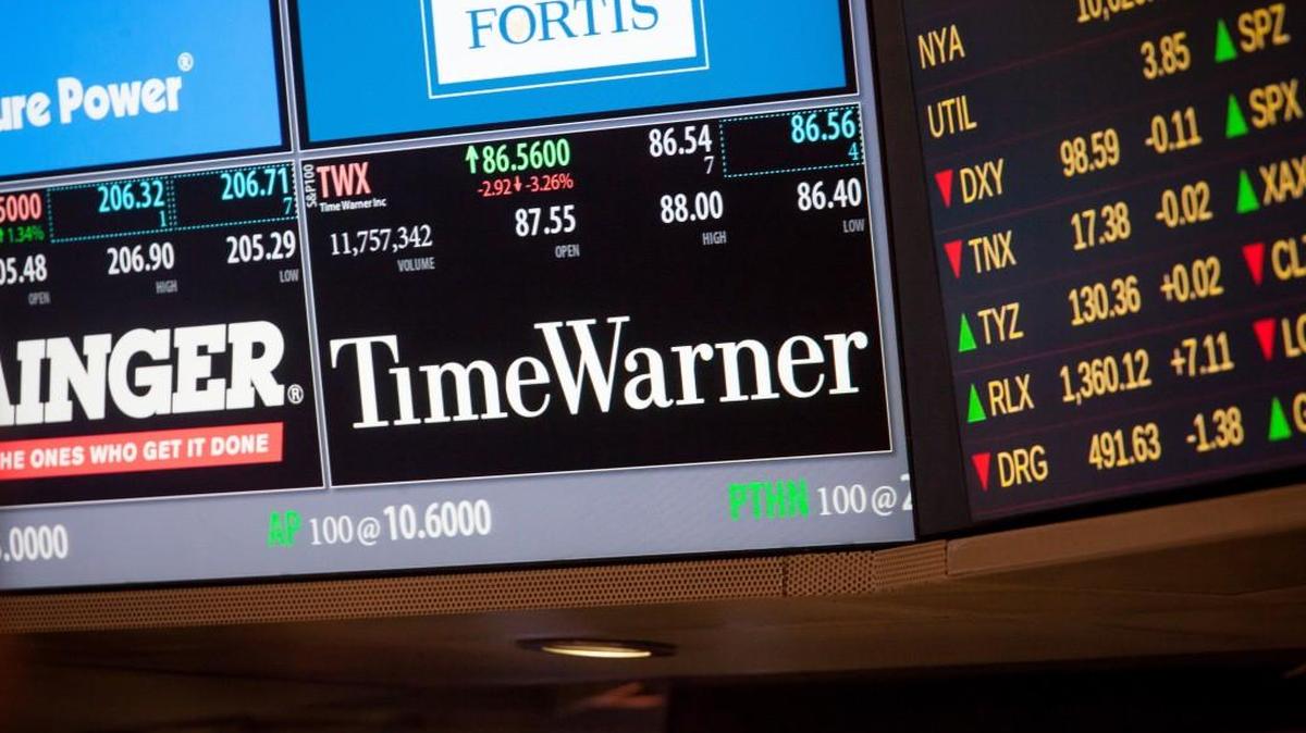 The company that AT&T Inc. wants to buy for $85.4 billion is Time Warner Inc., whose signage is displayed on a monitor on the floor of the New York Stock Exchange. The proposed deal does not include Time Warner Cable Inc., which became a separate company in 2009.