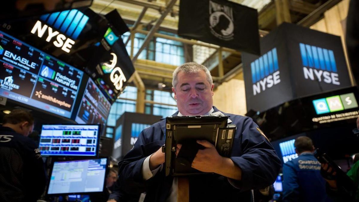 A trader worked Friday on the floor of the New York Stock Exchange.